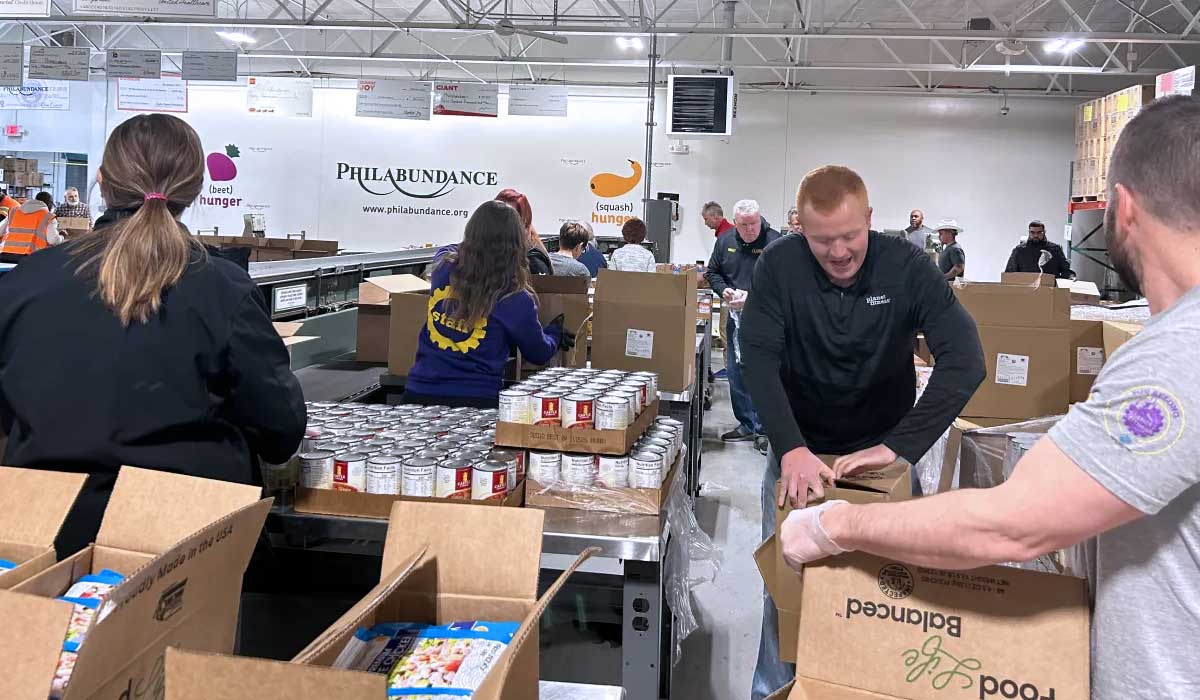 Planet Fitness Volunteers Help Pack Thousands of Meals at Philabundance